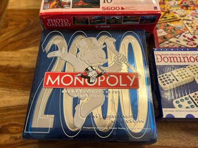 MONOPOLY MILLENNIUM ADDITION, DOUBLE 15 JUMBO DOMINOES, AND PUZZLES