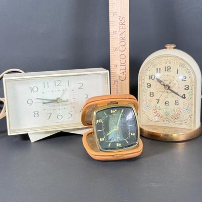 LOT 233D: Vintage Clocks: Elgin Leather Case Pocket Clock made in Western Germany & General Electric Clocks Models 7391-4 & 7309