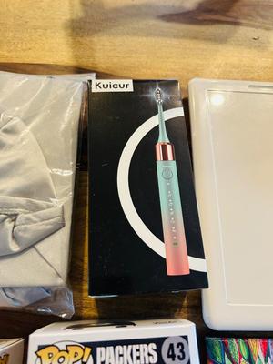 ANOTHER MISCELLANEOUS LOT FROM AN ELECTRIC TOOTHBRUSH TO A GRADUATION CAP AND GOWN