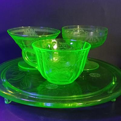 LOT 214: Uranium Glass Sunflower Cake P,ate, Tea Cup, Dessert Glass & Sherbert Glass