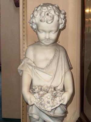 Marble statue-signed by the artist stands 33" tall. 1st floor.