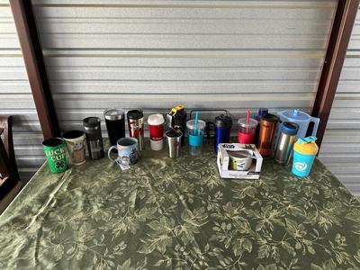 AN ARRAY OF TRAVEL CUPS, DRINKING GLASSES AND MORE