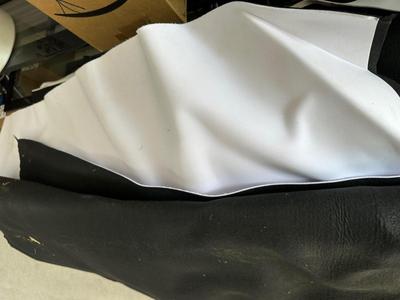 SEVERAL LARGER PIECES OF A FELT LIKE MATERIAL WITH A BACKING