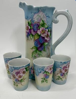 Sale Photo Thumbnail #11: Pale blue and white ceramic pitcher and cups.  Hand painted in 1968 by local artist Dorothy Tillotson of Tustin in 1968.  All in very good condition, no chips or cracks.