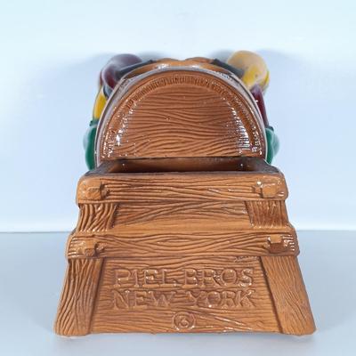 LOT 242: Vintage Piel's Beer Cast Metal Gnome-Themed Bottle Holder