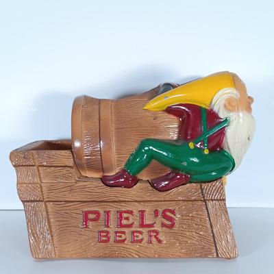 LOT 242: Vintage Piel's Beer Cast Metal Gnome-Themed Bottle Holder