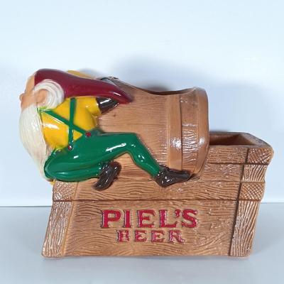 LOT 242: Vintage Piel's Beer Cast Metal Gnome-Themed Bottle Holder