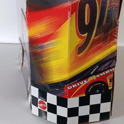 LOT 303: Barbie 1999 Nascar McDonald's Official #94 with (2) 50th Anniversary 1998 Barbies