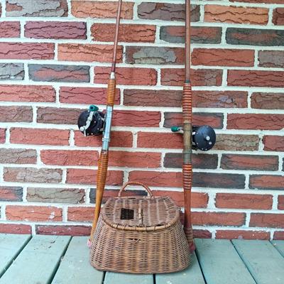LOT 309: Set of (2) Wooden Fishing Poles with Penn Reels No 35 and No 79 & Wicker Fishing Creel