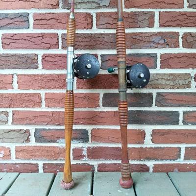 LOT 309: Set of (2) Wooden Fishing Poles with Penn Reels No 35 and No 79 & Wicker Fishing Creel
