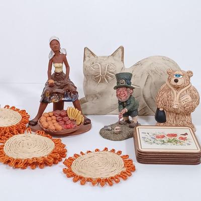 LOT 98L: Vintage Clay Art Woman Selling Fruit, Wood Folk Art Cat, Cantala Fiber Coasters & More