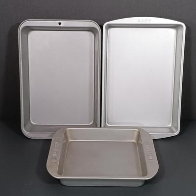 LOT 210K: Pyrex Stacking Mixing Bowls, Farberware Sheet Pan, Wilton Loaf Pan & More