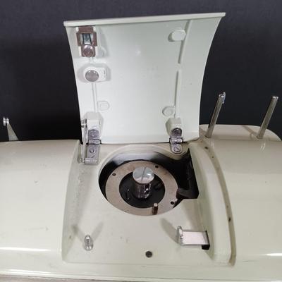 LOT 214L: Sears Kenmore 1701 Zig Zag Sewing Machine with Sewing Notions