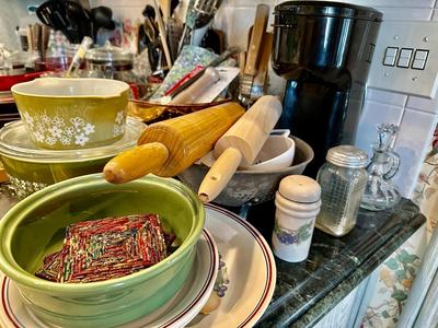 Kitchen Lot 11 - Right side of Stove top display includes Pyrex & Cast Iron