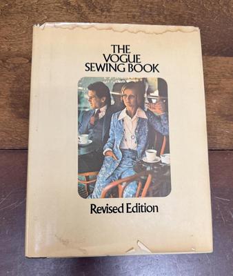 Sale Photo Thumbnail #269: Include sewing tips and solutions to all manner of home-sewing needs.  Dust jacket has a stain at the top and some age-related damage, but the book is in overall good condition.