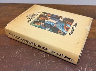 Sale Photo Thumbnail #267: Include sewing tips and solutions to all manner of home-sewing needs.  Dust jacket has a stain at the top and some age-related damage, but the book is in overall good condition.
