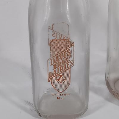LOT 88: Set of (7) Vintage Milk Bottles