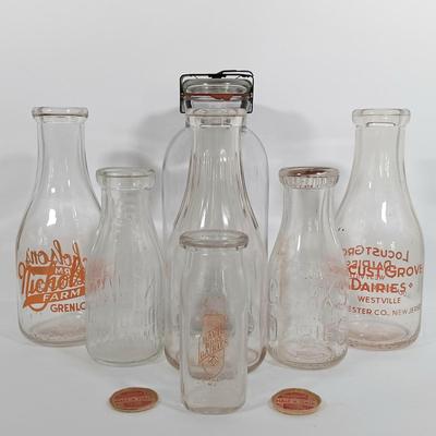 LOT 88: Set of (7) Vintage Milk Bottles