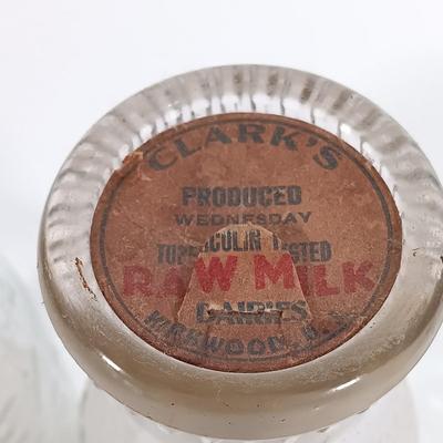 LOT 88: Set of (7) Vintage Milk Bottles