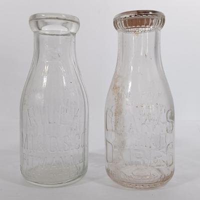 LOT 88: Set of (7) Vintage Milk Bottles