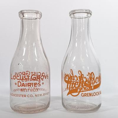 LOT 88: Set of (7) Vintage Milk Bottles