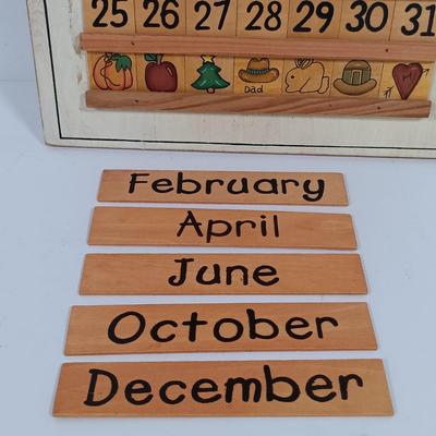 LOT 100: Imperial Milk Glass Roller with (3) Wood Rollers, Egg Beater & Wood Calendar