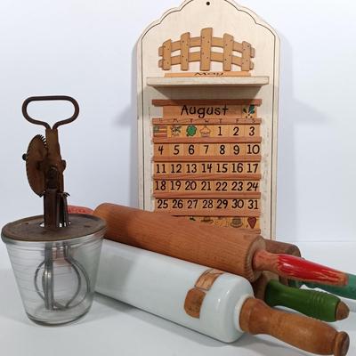 LOT 100: Imperial Milk Glass Roller with (3) Wood Rollers, Egg Beater & Wood Calendar