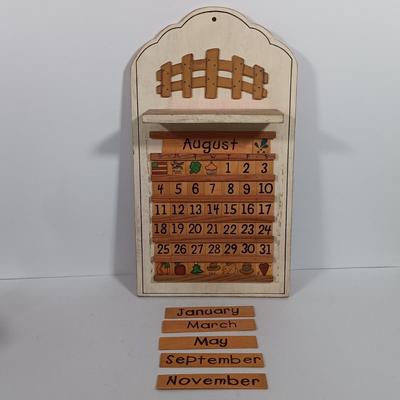 LOT 100: Imperial Milk Glass Roller with (3) Wood Rollers, Egg Beater & Wood Calendar