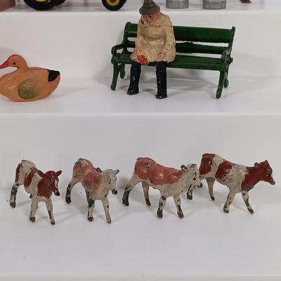 LOT 192: Miniature Lead Cows, Celluloid Pigs, Lead People, Celluloid Duck & More