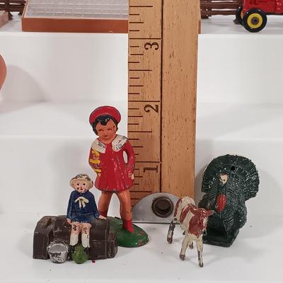 LOT 192: Miniature Lead Cows, Celluloid Pigs, Lead People, Celluloid Duck & More