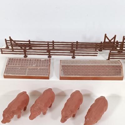LOT 192: Miniature Lead Cows, Celluloid Pigs, Lead People, Celluloid Duck & More