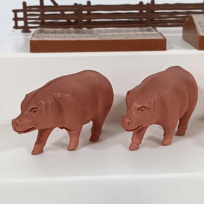 LOT 192: Miniature Lead Cows, Celluloid Pigs, Lead People, Celluloid Duck & More