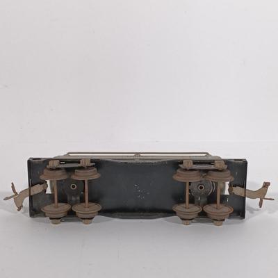 LOT 193: Lionel 1682 Red Caboose, 1680 Sunoco Tank Car, Flat Car with Lumber, 1679 Baby Ruth Box Car & More