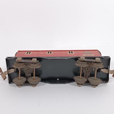 LOT 193: Lionel 1682 Red Caboose, 1680 Sunoco Tank Car, Flat Car with Lumber, 1679 Baby Ruth Box Car & More