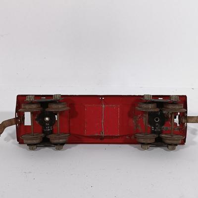 LOT 193: Lionel 1682 Red Caboose, 1680 Sunoco Tank Car, Flat Car with Lumber, 1679 Baby Ruth Box Car & More