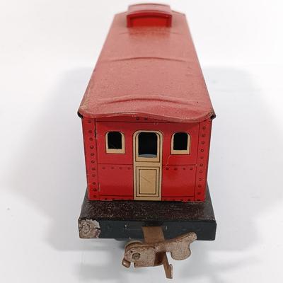 LOT 193: Lionel 1682 Red Caboose, 1680 Sunoco Tank Car, Flat Car with Lumber, 1679 Baby Ruth Box Car & More