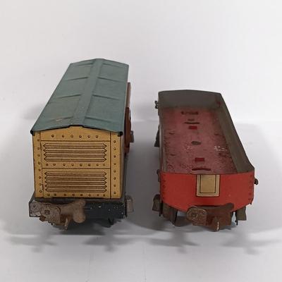 LOT 193: Lionel 1682 Red Caboose, 1680 Sunoco Tank Car, Flat Car with Lumber, 1679 Baby Ruth Box Car & More