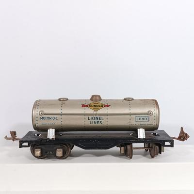 LOT 193: Lionel 1682 Red Caboose, 1680 Sunoco Tank Car, Flat Car with Lumber, 1679 Baby Ruth Box Car & More