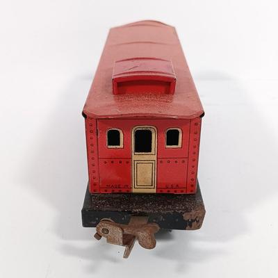 LOT 193: Lionel 1682 Red Caboose, 1680 Sunoco Tank Car, Flat Car with Lumber, 1679 Baby Ruth Box Car & More