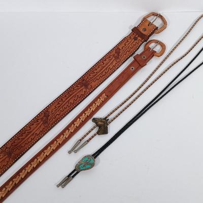 LOT 195: Tony Lama Tooled Leather Acorn Belt, Braided and Tooled Leather Belt Made in Mexico & (2) Vintage Bolo Ties