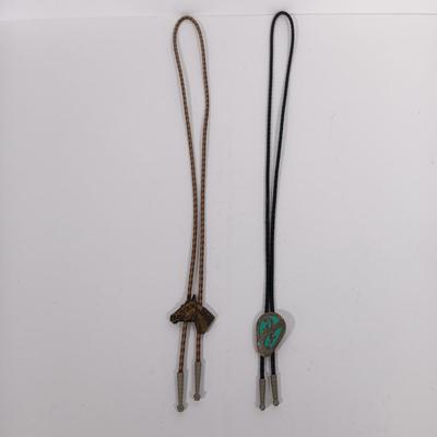 LOT 195: Tony Lama Tooled Leather Acorn Belt, Braided and Tooled Leather Belt Made in Mexico & (2) Vintage Bolo Ties