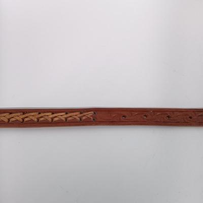 LOT 195: Tony Lama Tooled Leather Acorn Belt, Braided and Tooled Leather Belt Made in Mexico & (2) Vintage Bolo Ties