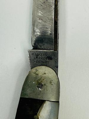 Sale Photo Thumbnail #144: Missing piece of the M-O-P handle, and largest blade does not fully close. See photos for details.