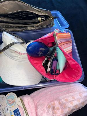 Sale Photo Thumbnail #376: Container of women's accessories including a hat, package of new underwear, handbag, socks, and foot spa items