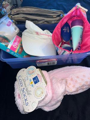 Sale Photo Thumbnail #374: Container of women's accessories including a hat, package of new underwear, handbag, socks, and foot spa items