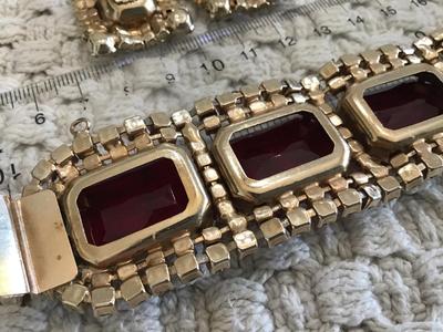 Found similar on eBay and Etsy stating it is. Please do your research Gorgeous DE Juliana Red Clear Rhinestone Set