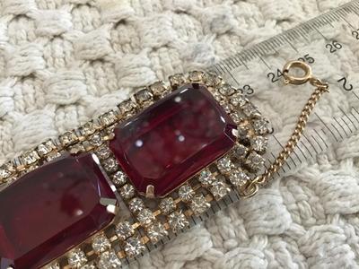 Found similar on eBay and Etsy stating it is. Please do your research Gorgeous DE Juliana Red Clear Rhinestone Set