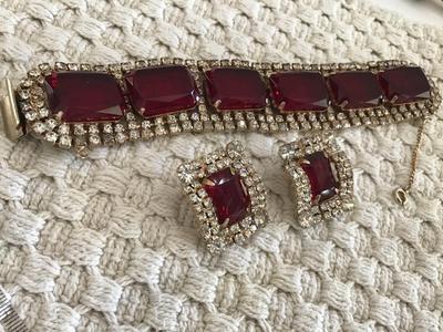 Found similar on eBay and Etsy stating it is. Please do your research Gorgeous DE Juliana Red Clear Rhinestone Set
