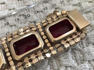 Found similar on eBay and Etsy stating it is. Please do your research Gorgeous DE Juliana Red Clear Rhinestone Set