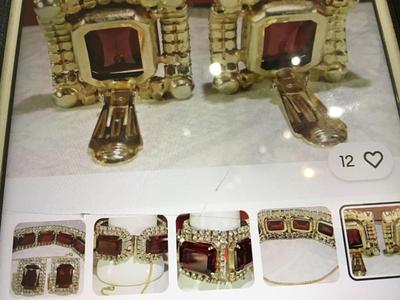 Found similar on eBay and Etsy stating it is. Please do your research Gorgeous DE Juliana Red Clear Rhinestone Set